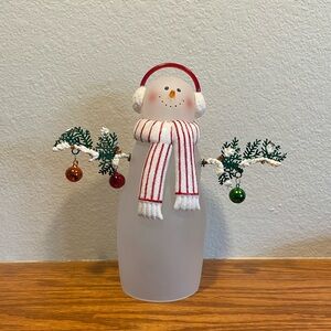 Glass snowman with detachable twig arms.